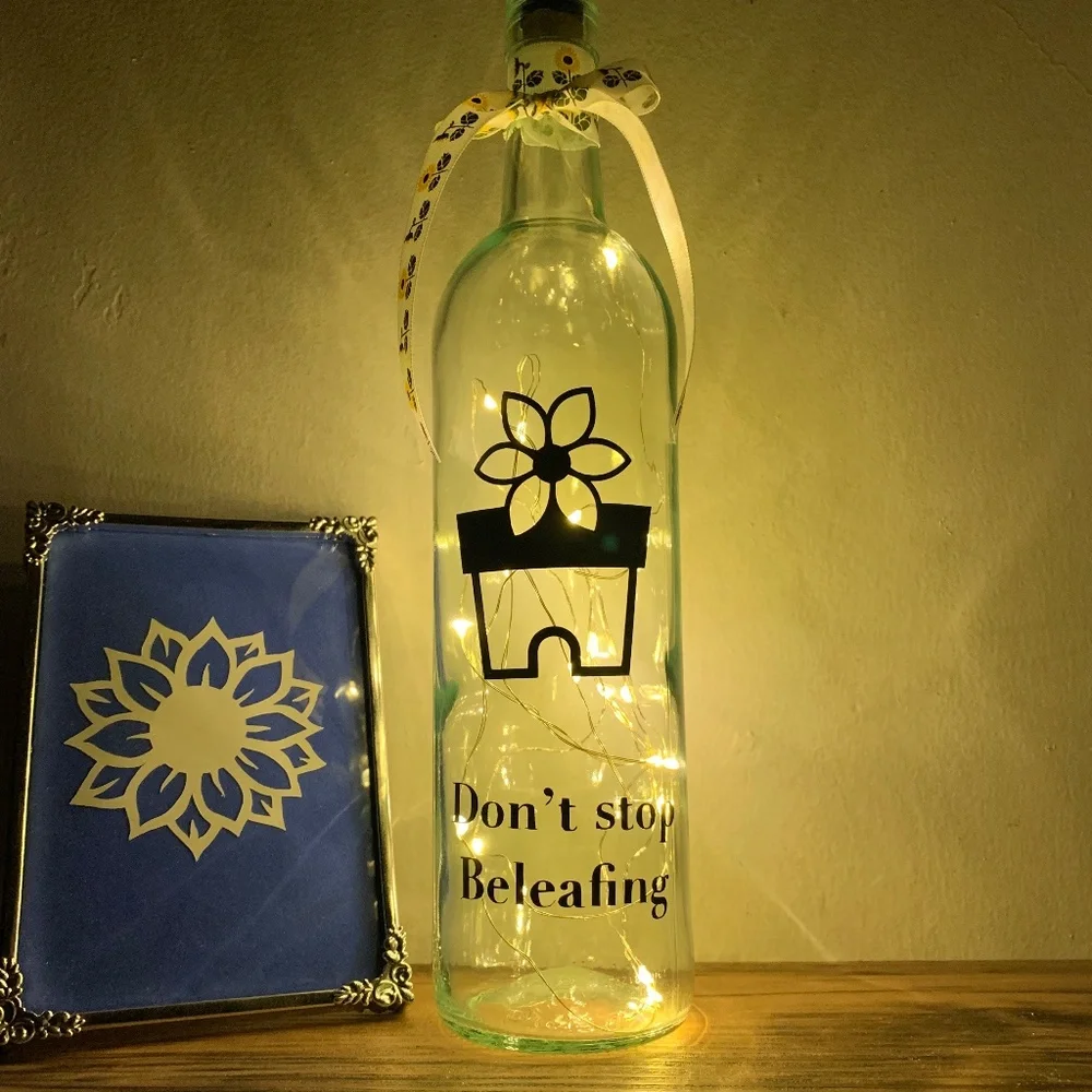 ‘Don’t Stop Beleafing’ logo wine bottle lantern